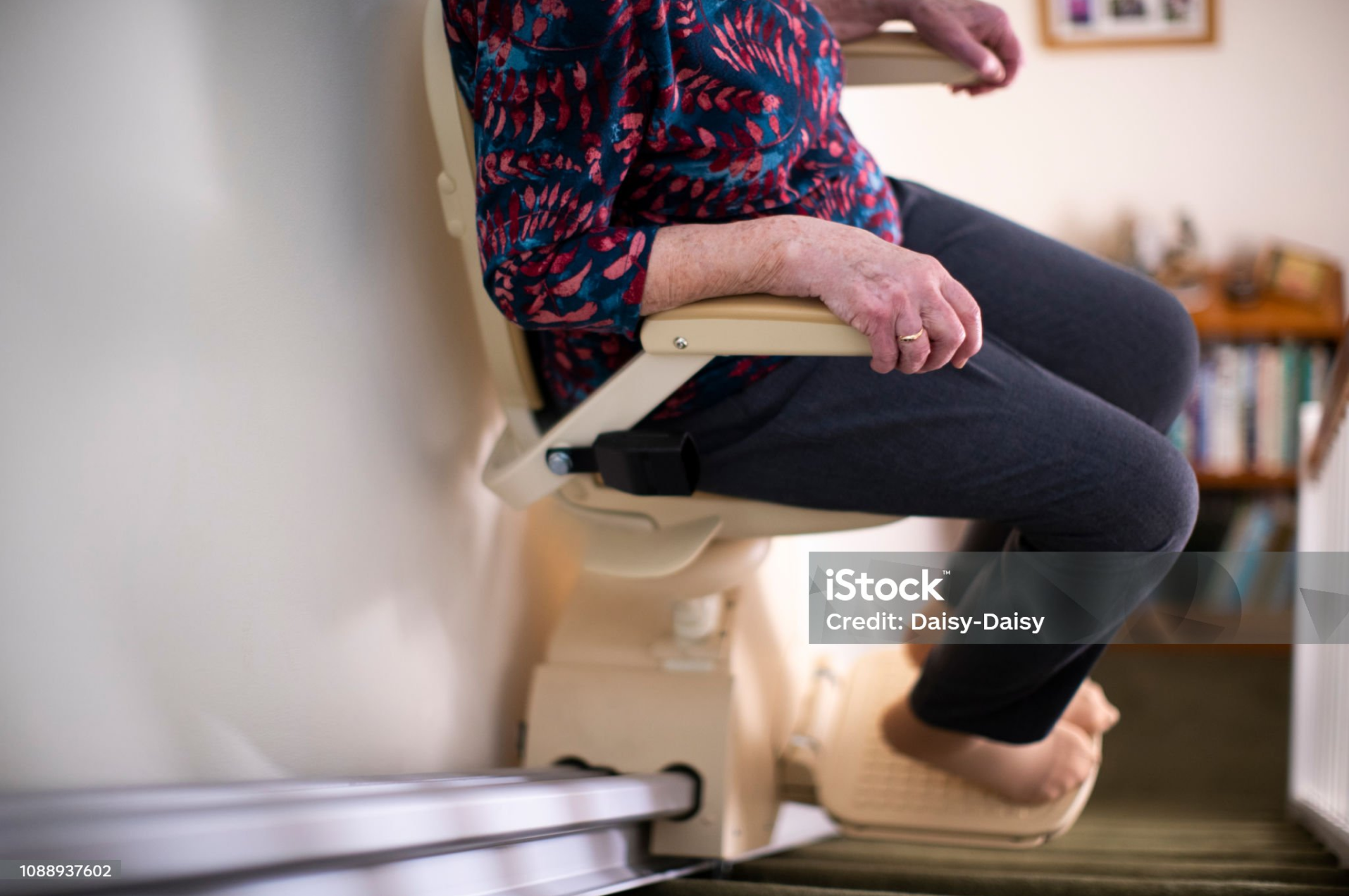Elderly lady on stairlift